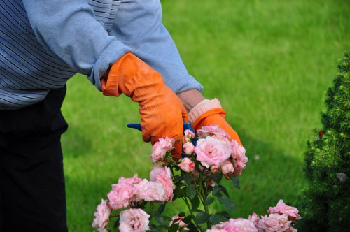 Garden maintenance crew working on seasonal planting in a Docklands courtyard